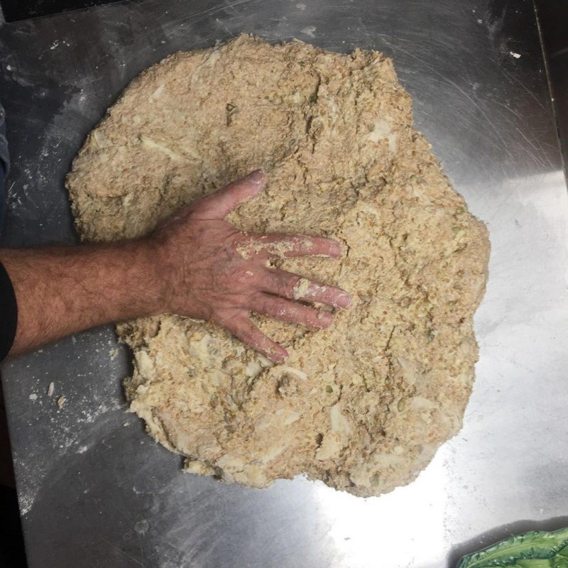 This morning’s workout: 4.6 kg of seedy dough. Hand for scale.