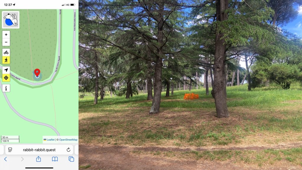 Composite image. On the left a map showing the location of the quest and my position. On the right, a view under some umbrella pines with patchy grass and a bare path in the foreground. In the middle distance is a small enclosure of bright orange mesh netting.