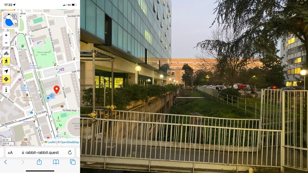 Composite image with my location on the left and the rabbit quest on the right; a parking lot between two modern, glassed buildings overhung by conifer branches