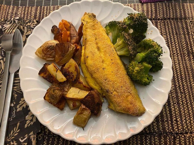 Pan fried orata with a polenta crust, plus steamed broccoli, oven potatoes and left over sweet potatoes